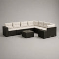 8-teiliges Gartensofa-Lounge-Set aus PE-Rattan und Stahl mit Polyesterpolstern, Hocker und Glastisch, L-Form, Schwarz/Cremeweiß/Rauchgrau, 264 × 202 × 73 cm